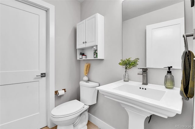 3178 N Race St, Denver, CO 80205 - half bathroom featuring toilet and baseboards