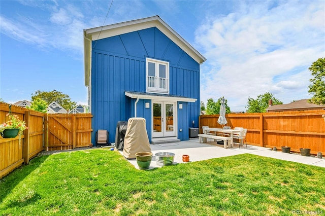 3178 N Race St, Denver, CO 80205 - rear view of house featuring board and batten siding, a patio, french doors, a gate, and central AC