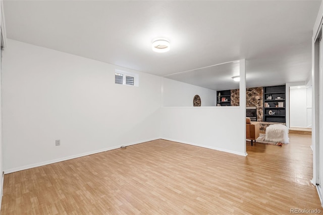 8369 W 77th Way, Arvada, CO 80005 - below grade area featuring built in shelves and light wood-type flooring