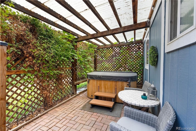 8369 W 77th Way, Arvada, CO 80005 - view of patio with a hot tub and a pergola