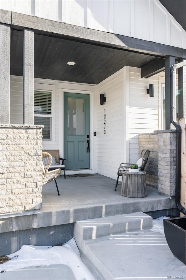 doorway to property with covered porch