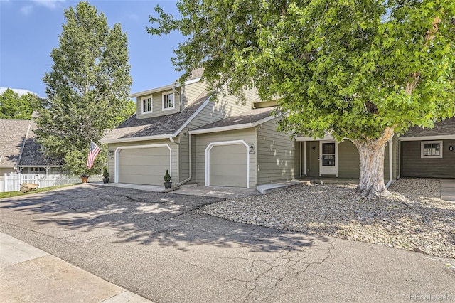 10685 W Apishapa Pass, Littleton, CO 80127 - view of front of property featuring driveway, a garage, and a shingled roof