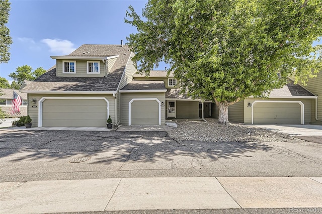 10685 W Apishapa Pass, Littleton, CO 80127 - view of front of house with roof with shingles and driveway