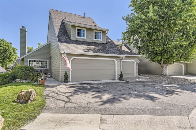 10685 W Apishapa Pass, Littleton, CO 80127 - view of front of property featuring asphalt driveway and roof with shingles