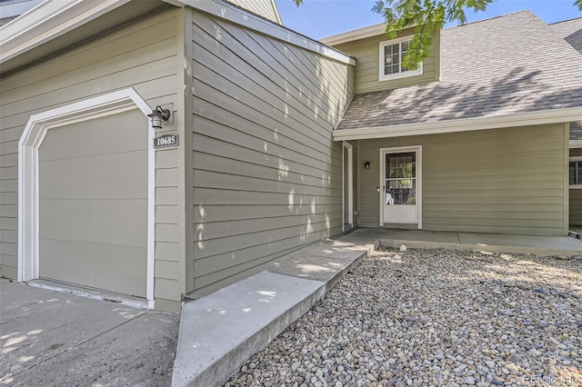10685 W Apishapa Pass, Littleton, CO 80127 - doorway to property with a shingled roof