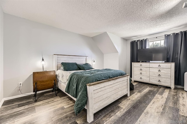 10685 W Apishapa Pass, Littleton, CO 80127 - bedroom with dark wood-style flooring, a textured ceiling, and baseboards