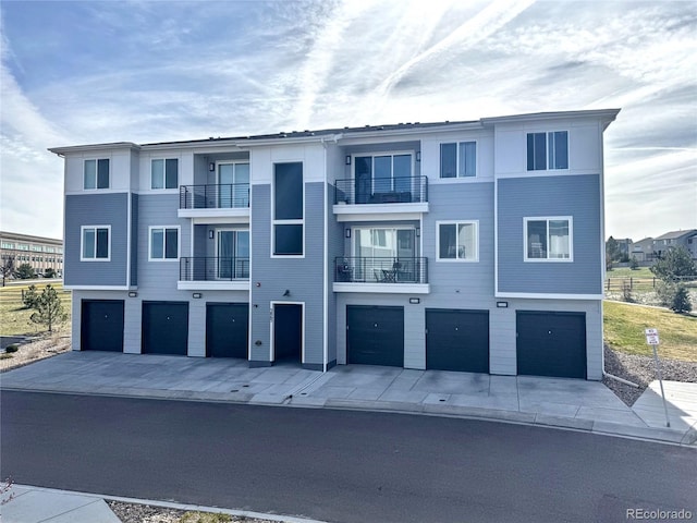 3865 Presidio Pt Unit 101, Colorado Springs, CO 80920 - view of building exterior with an attached garage