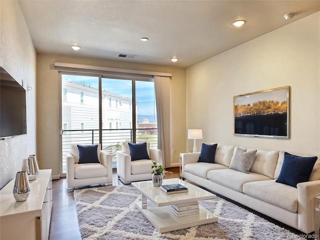 3865 Presidio Pt Unit 101, Colorado Springs, CO 80920 - living area with wood finished floors and recessed lighting