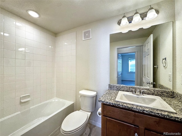 3865 Presidio Pt Unit 101, Colorado Springs, CO 80920 - full bathroom with a textured wall, toilet, a textured ceiling, and vanity