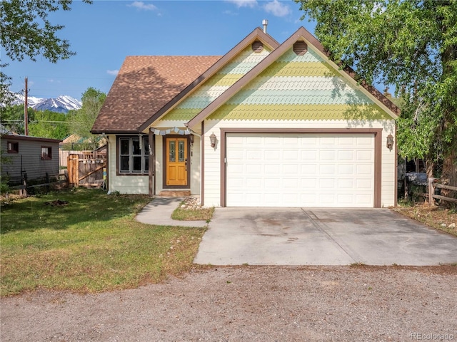 120 S San Juan Ave, Buena Vista, CO 81211 - view of front facade featuring an attached garage, driveway, and roof with shingles