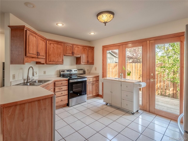 120 S San Juan Ave, Buena Vista, CO 81211 - kitchen with stainless steel range with electric cooktop, a sink, healthy amount of natural light, light countertops, and recessed lighting