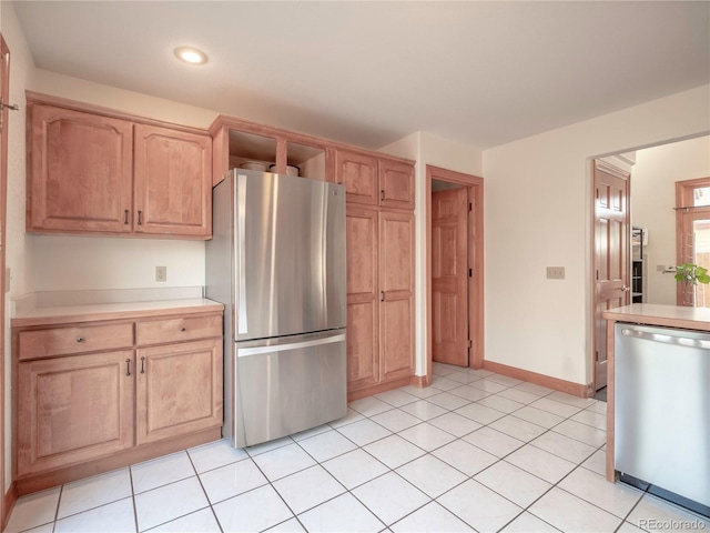 120 S San Juan Ave, Buena Vista, CO 81211 - kitchen with stainless steel appliances, light countertops, recessed lighting, light tile patterned flooring, and baseboards