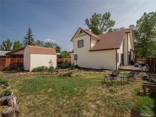 120 S San Juan Ave, Buena Vista, CO 81211 - back of house with a shingled roof, a deck, and a fire pit
