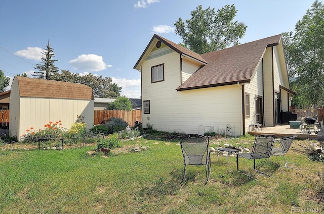 120 S San Juan Ave, Buena Vista, CO 81211 - view of home's exterior with an outdoor fire pit and roof with shingles