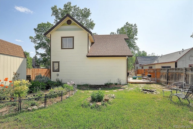120 S San Juan Ave, Buena Vista, CO 81211 - back of house featuring a fenced backyard, a wooden deck, and roof with shingles