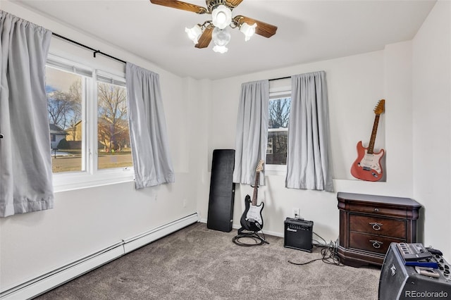 miscellaneous room featuring light colored carpet, plenty of natural light, a baseboard heating unit, and ceiling fan