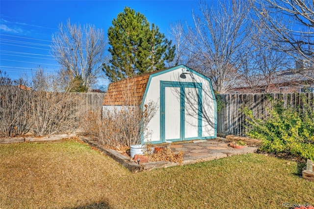 view of outdoor structure with a lawn