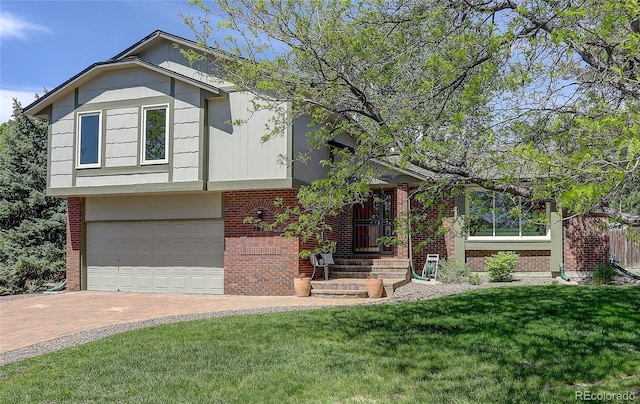 7877 W 110th Dr, Westminster, CO 80021 - view of front of home with brick siding, a front lawn, decorative driveway, and a garage