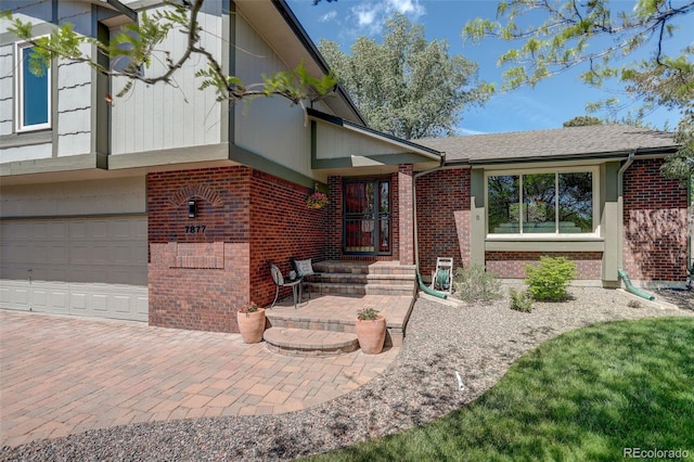 7877 W 110th Dr, Westminster, CO 80021 - doorway to property featuring brick siding and a garage