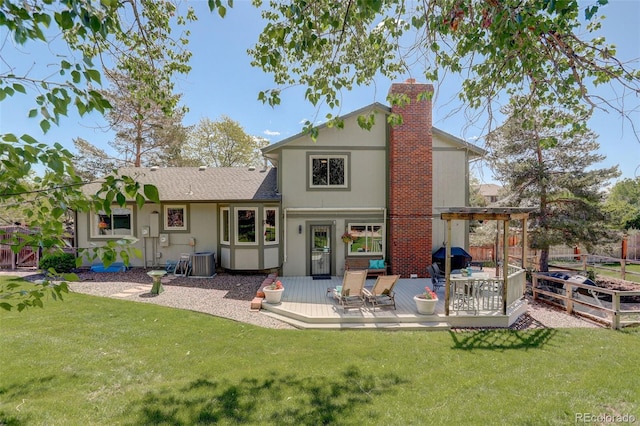 7877 W 110th Dr, Westminster, CO 80021 - back of property with a wooden deck, a chimney, and cooling unit