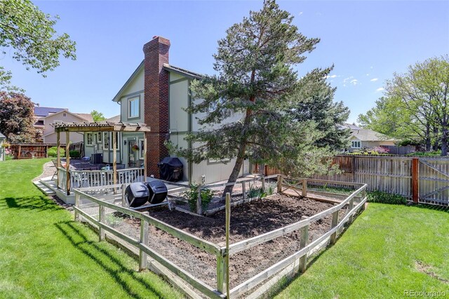 7877 W 110th Dr, Westminster, CO 80021 - rear view of house featuring a garden, a pergola, and a chimney