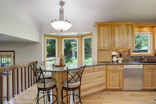 7877 W 110th Dr, Westminster, CO 80021 - kitchen featuring dishwasher, light brown cabinets, and plenty of natural light