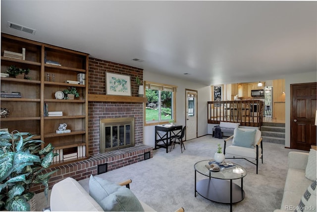 7877 W 110th Dr, Westminster, CO 80021 - living area with a fireplace, light carpet, and stairway
