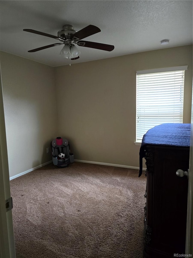 5131 Delphinium Cir, Brighton, CO 80601 - carpeted bedroom featuring baseboards, ceiling fan, and a textured ceiling