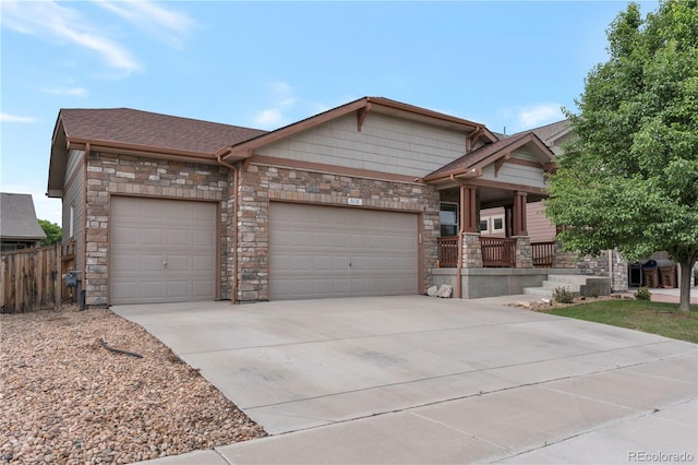 5131 Delphinium Cir, Brighton, CO 80601 - craftsman inspired home with an attached garage, concrete driveway, stone siding, and covered porch