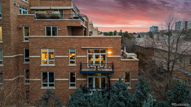 view of outdoor building at dusk