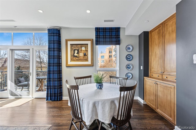 dining room featuring dark hardwood / wood-style flooring