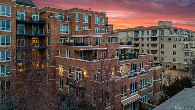 view of outdoor building at dusk