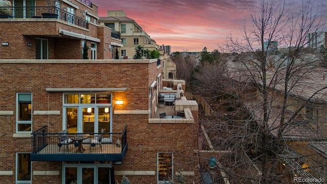 view of back house at dusk