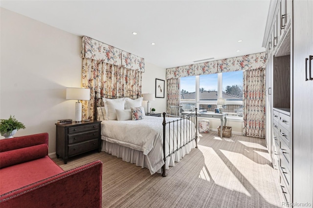 bedroom featuring light colored carpet