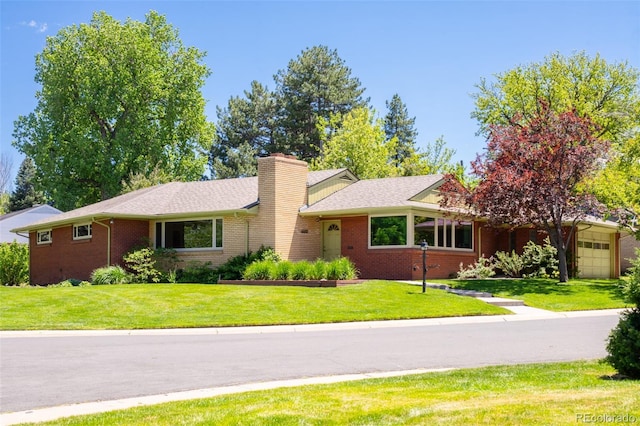 6600 E 4th Ave, Denver, CO 80220 - ranch-style house featuring brick siding, a front lawn, and a chimney