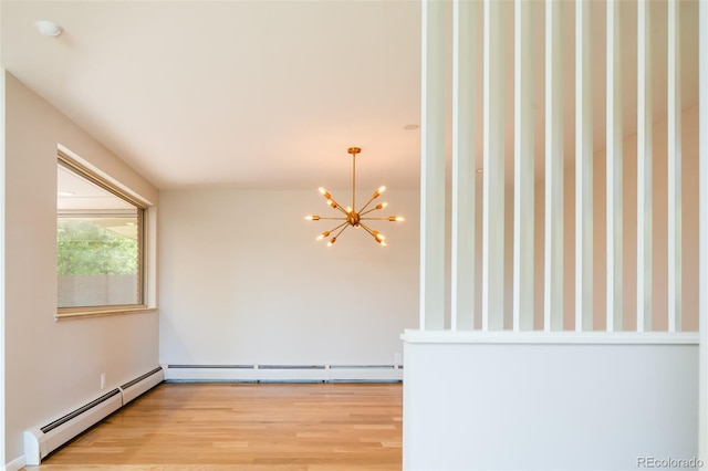 6600 E 4th Ave, Denver, CO 80220 - empty room featuring a baseboard heating unit, a chandelier, light wood finished floors, and a baseboard radiator