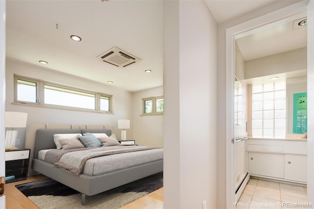 6600 E 4th Ave, Denver, CO 80220 - bedroom featuring a baseboard heating unit and recessed lighting