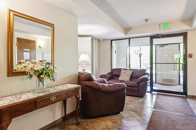 7420 E Quincy Ave Unit 304, Denver, CO 80237 - common area featuring a textured ceiling and a surveillance system