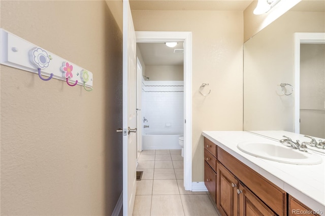 full bath featuring toilet, washtub / shower combination, tile patterned flooring, and vanity