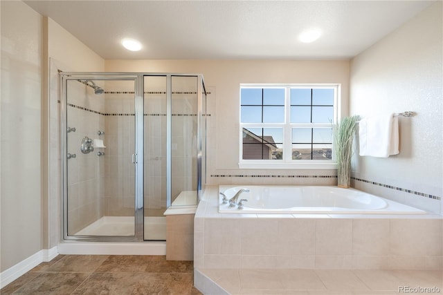 bathroom with a garden tub and a shower stall