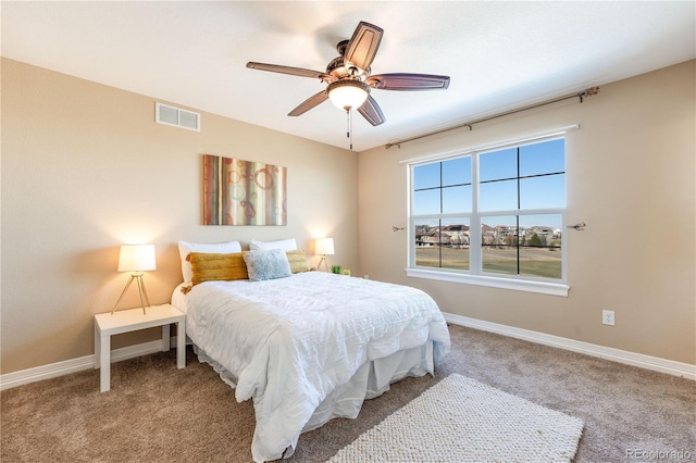 bedroom with carpet floors, baseboards, visible vents, and ceiling fan