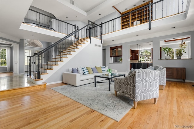 18963 E Long Ave, Centennial, CO 80016 - living area with a towering ceiling, wood finished floors, and stairway