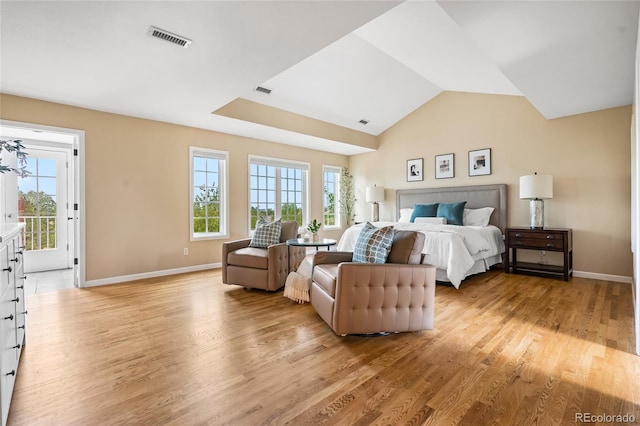 18963 E Long Ave, Centennial, CO 80016 - bedroom with multiple windows, light wood-style flooring, access to exterior, and vaulted ceiling