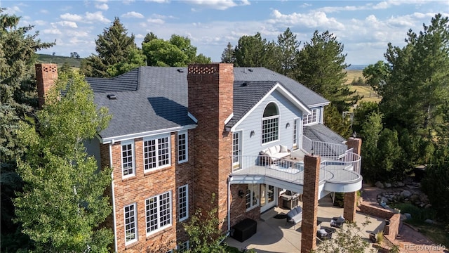 18963 E Long Ave, Centennial, CO 80016 - rear view of property with a chimney, a patio, and a shingled roof