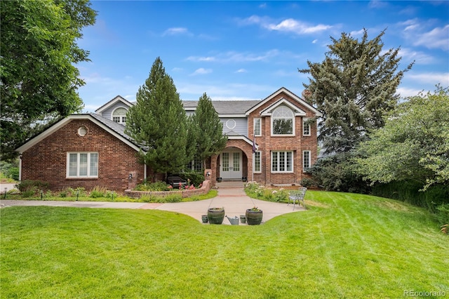 18963 E Long Ave, Centennial, CO 80016 - traditional-style house featuring french doors, brick siding, and a front yard