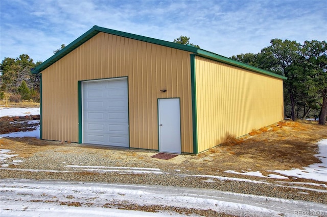 view of snow covered garage