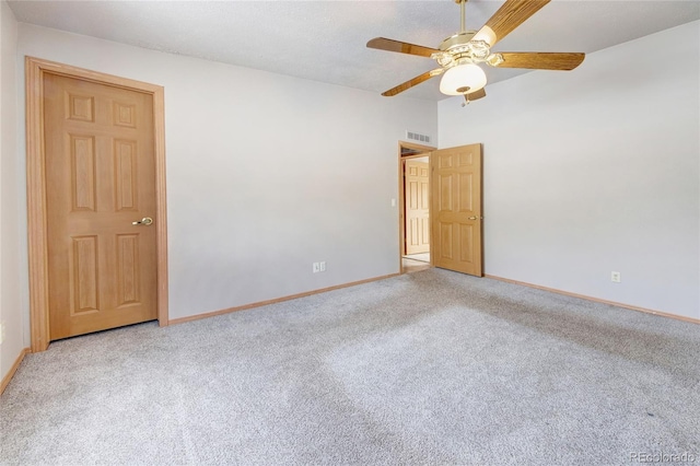 carpeted empty room with ceiling fan