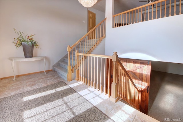 stairway with a towering ceiling