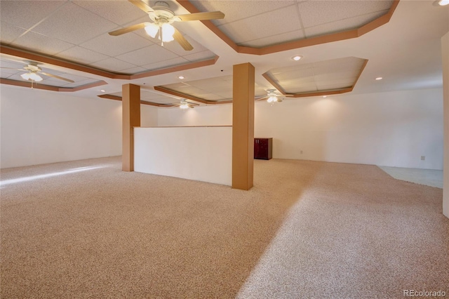 basement featuring ceiling fan and carpet floors