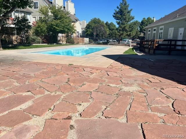 view of swimming pool featuring a fenced in pool, a patio area, and fence